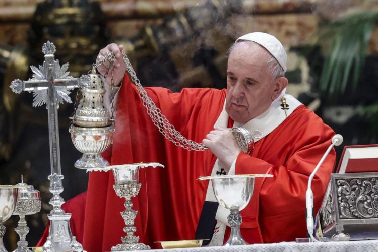 Pope Francis swings a thurible of incense around the altar as he celebrates Palm Sunday mass on March 28, 2021 in The Vatican, amid the coronavirus Covid-19 pandemic. (Photo by Giuseppe LAMI / POOL / AFP)