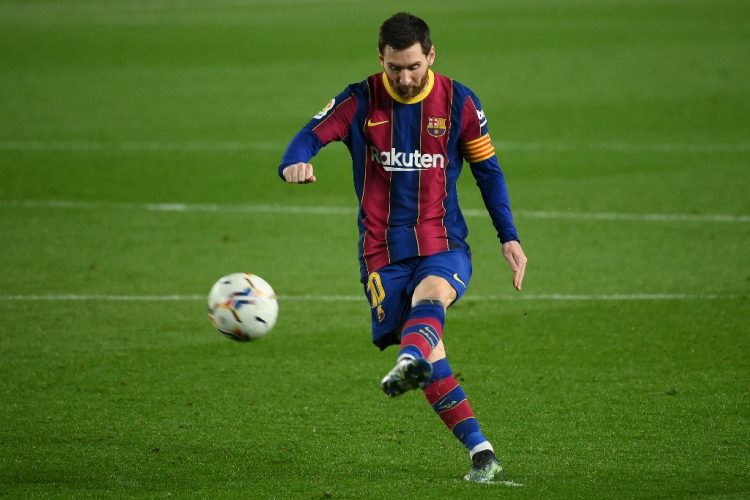 Barcelona's Argentinian forward Lionel Messi kicks the ball during the Spanish league football match between FC Barcelona and Elche CF at the Camp Nou stadium in Barcelona on February 24, 2021. (Photo by LLUIS GENE / AFP)