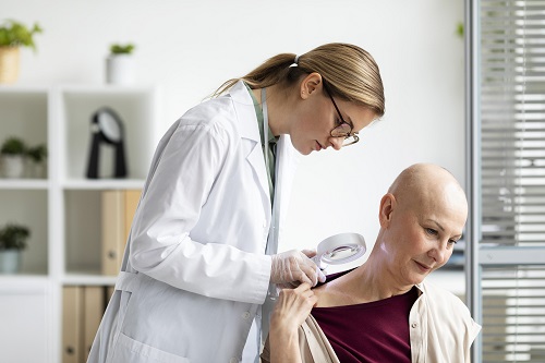 doctor doing check on patient with skin cancer