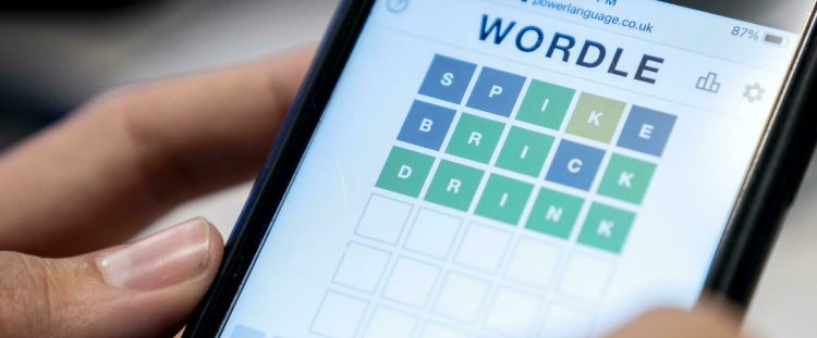 A photo illustration depicts a person playing Wordle on a cellphone in Washington DC on January 11, 2022. (Photo by Stefani Reynolds/AFP)