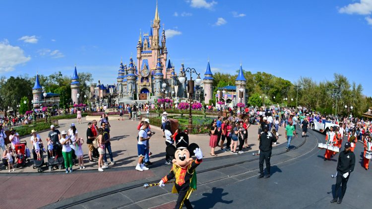 LAKE BUENA VISTA, FLORIDA - MARCH 03: Mickey Mouse waves to fans during a parade at Walt Disney World Resort on March 03, 2022 in Lake Buena Vista, Florida. (Photo by Julio Aguilar/Getty Images for Disney Dreamers Academy)