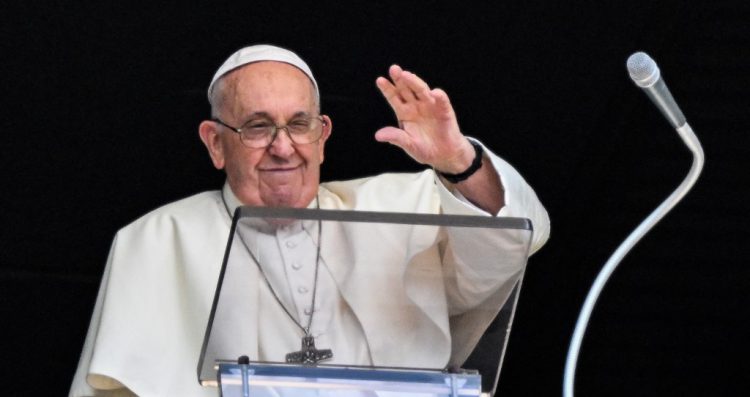 Pope Francis waves from the window of the apostolic palace overlooking St. Peter's square during the weekly Angelus prayer on July 30, 2023 in The Vatican. (Photo by Vincenzo PINTO / AFP)