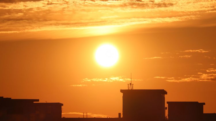 Celestial delights in Toronto!  The sun is rising on a hot summer Day.