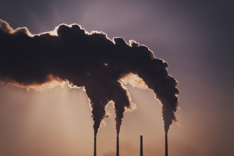 Air pollution clouds of smoke coming from the chimneys. Energy plantCombined heat and power