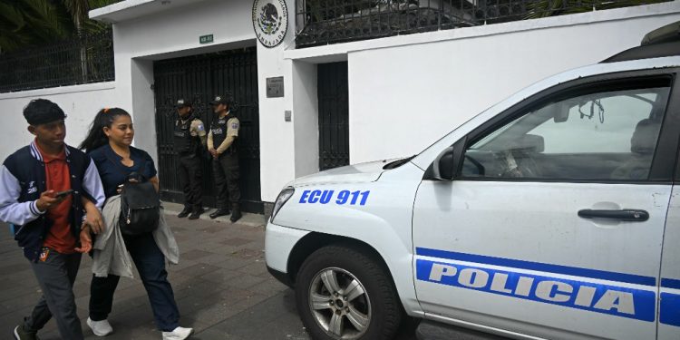 Police guard outside the Mexican embassy in Quito on April 8, 2024. (Photo by Rodrigo BUENDIA / AFP)