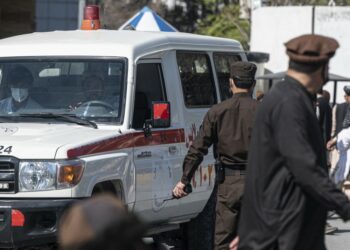 An ambulance carries victims from near the site of a suicide attack in Kabul on March 27, 2023. A suicide attack on March 27 not far from Afghanistan's foreign ministry killed six civilians and wounded several others, the interior ministry said. (Photo by Wakil KOHSAR / AFP)