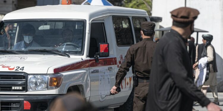 An ambulance carries victims from near the site of a suicide attack in Kabul on March 27, 2023. A suicide attack on March 27 not far from Afghanistan's foreign ministry killed six civilians and wounded several others, the interior ministry said. (Photo by Wakil KOHSAR / AFP)