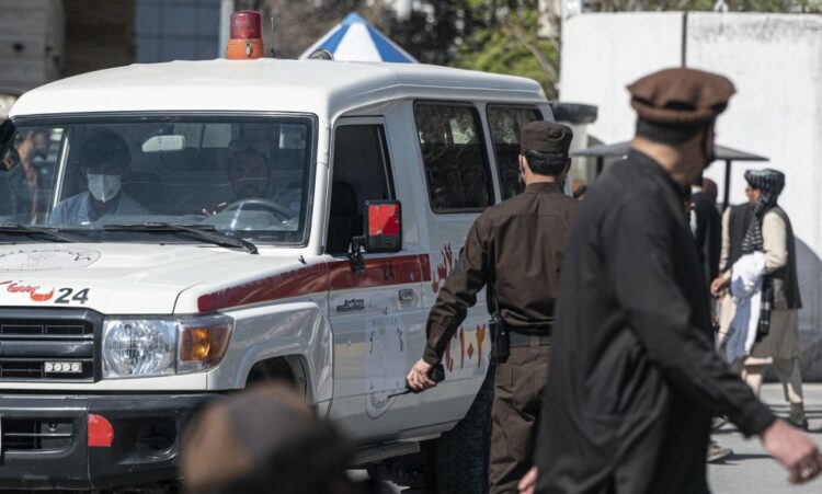 An ambulance carries victims from near the site of a suicide attack in Kabul on March 27, 2023. A suicide attack on March 27 not far from Afghanistan's foreign ministry killed six civilians and wounded several others, the interior ministry said. (Photo by Wakil KOHSAR / AFP)