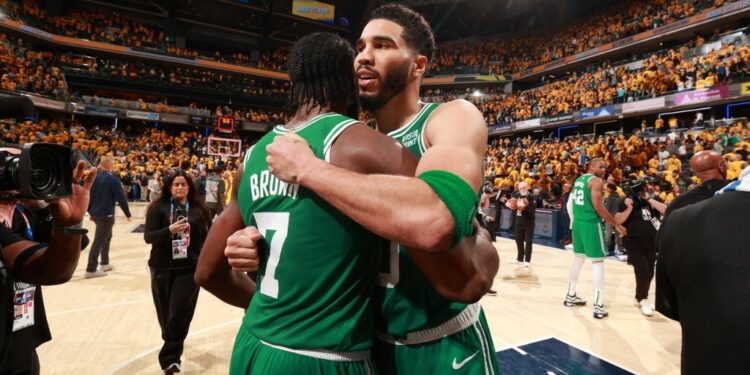 INDIANAPOLIS, IN - MAY 25: Jayson Tatum #0 and Jaylen Brown #7 of the Boston Celtics embrace after the game against the Indiana Pacers during Game 3 of the Eastern Conference Finals of the 2024 NBA Playoffs on May 25, 2024 at Gainbridge Fieldhouse in Indianapolis, Indiana. NOTE TO USER: User expressly acknowledges and agrees that, by downloading and or using this Photograph, user is consenting to the terms and conditions of the Getty Images License Agreement. Mandatory Copyright Notice: Copyright 2024 NBAE   Nathaniel S. Butler/NBAE via Getty Images/AFP (Photo by Nathaniel S. Butler / NBAE / Getty Images / Getty Images via AFP)