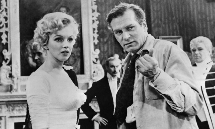 (FILES) Film director Laurence Olivier directs US actress Marilyn Monroe on August 14, 1956 during the filming of "The Prince and the Showgirl" at Pinewood's studios near London. The Los Angeles home where Marilyn Monroe died was declared a historic landmark on June 26, 2024, thwarting plans by its current owners to demolish the property. (Photo by AFP)