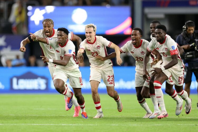 Canada's players celebrate their victory after a penalty shoot-out during the Conmebol 2024 Copa America tournament quarter-final football match between Venezuela and Canada at AT&T Stadium in Arlington, Texas, on July 5, 2024. (Photo by CHARLY TRIBALLEAU / AFP)